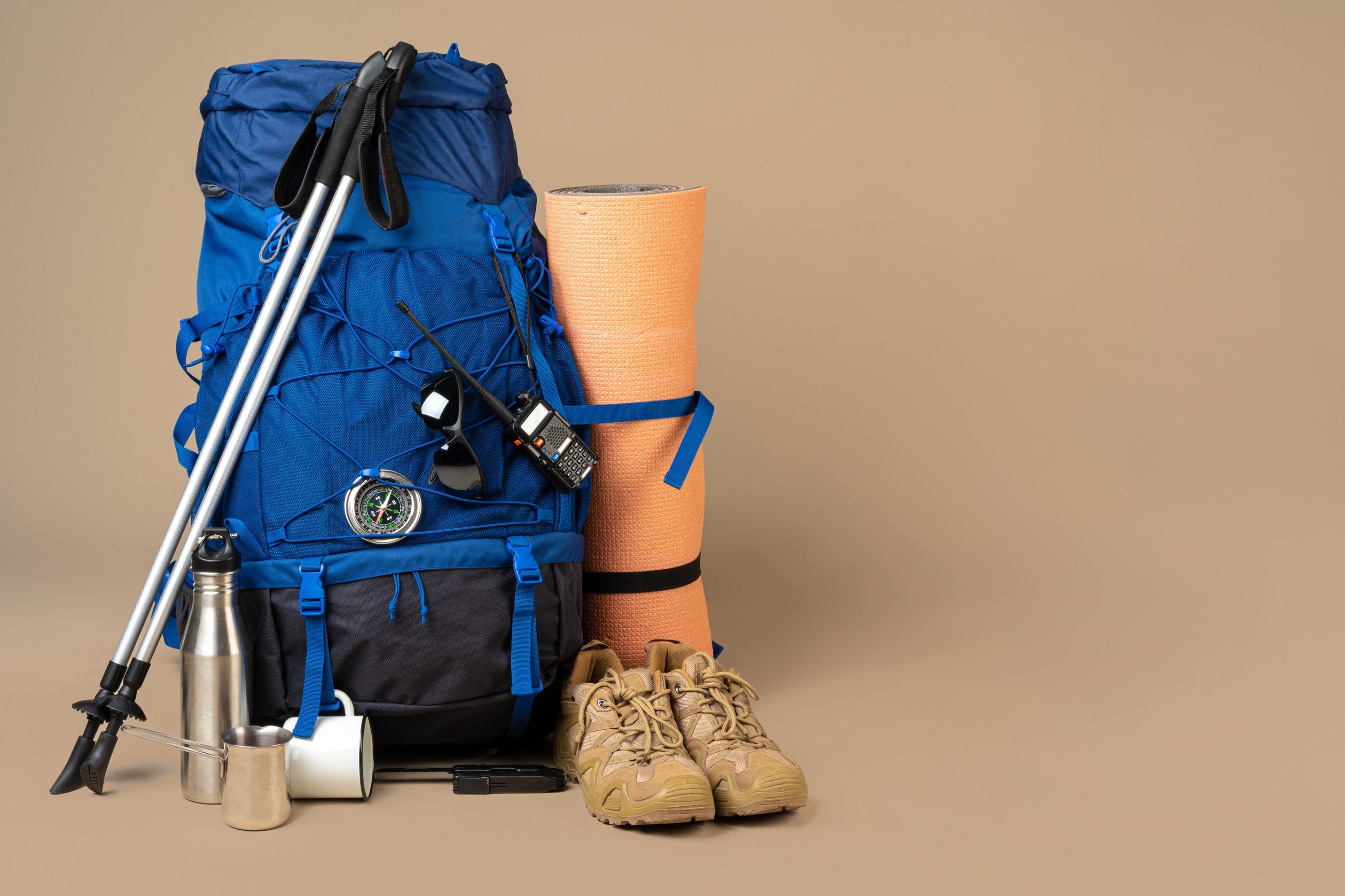 blue-backpack-and-hiking-boots-mountain-gear.jpg__PID:b908fa3a-8a26-4a76-bc9b-d06112e10d60